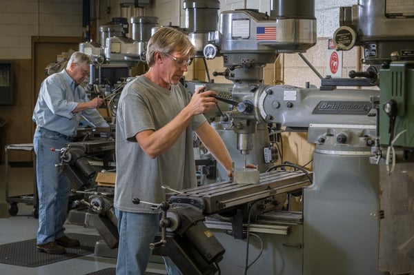 Rodon employees using machining equipment in Rodon's facility