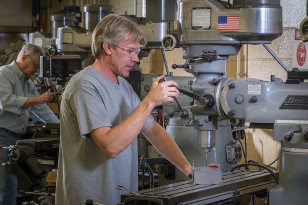 Employees working machinery in Rodon's facility